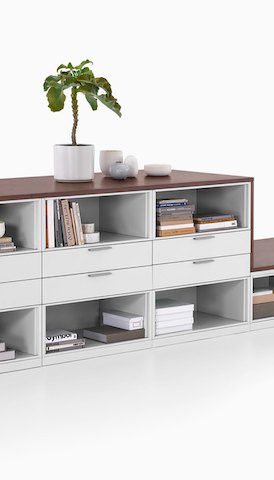 A storage unit with drawers and shelves. Select to go to the Herman Miller Storage product page.