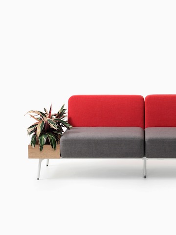 Red and grey Sabha seating with a built-in planter. Select to go to the Sabha Collaborative Seating product page.