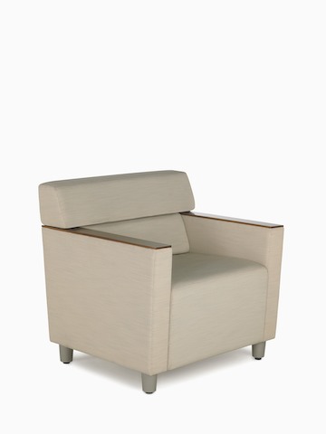 A beige Steps Lounge System chair with wood arm caps. Select to go to the Steps Lounge System product page.
